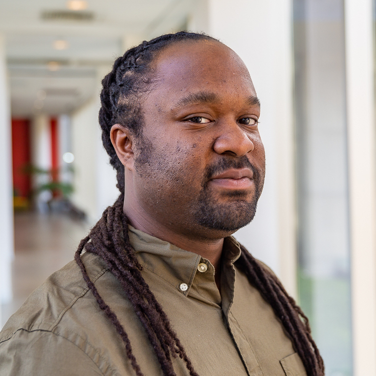 A headshot of Patrick Carrington