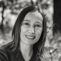 Shari Trewin, wearing blue wooly clothes as usual, smiling as usual, and outdoors as she wishes was usual!